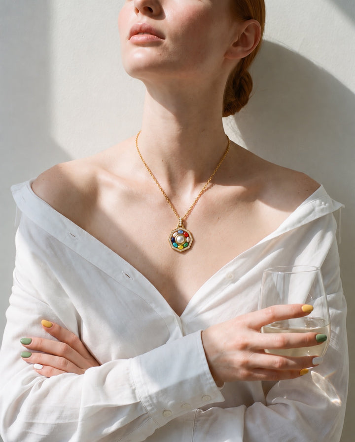 ORA Necklace worn with a white shirt — the octagonal pendant at the neckline